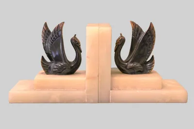 Art déco boekensteunen met zwanen