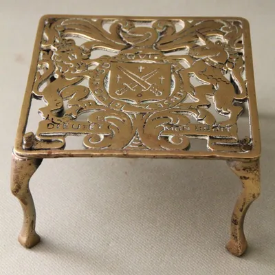 Messing onderzetter 19e eeuw