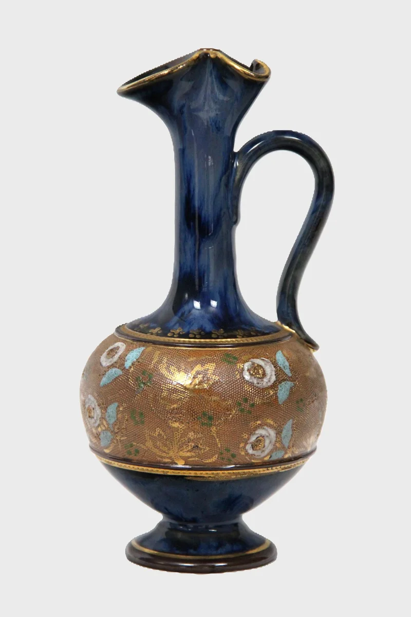 Royal Doulton schenkkannetje, één van een paar (2) - Porselein › Vazen - €135.00 - Gemerkt Royal Doulton.
Datumstempel 1902-1936
21.5cm hoog

Prijs voor het paar