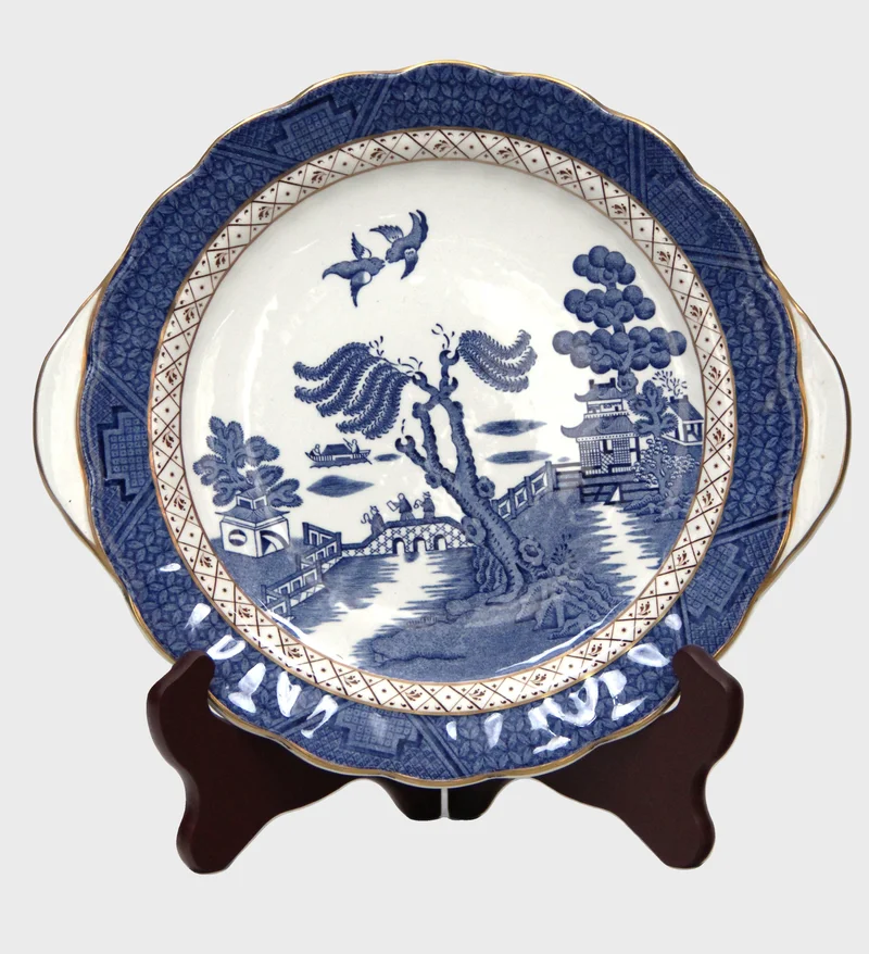 Weeping willow koekjesschotel - Porselein › Schalen - Engelse schaal met typisch blauw-wit Weeping Willow motief. 
Gemerkt; Booths Real Old Willow
28.5 x 25.5cm
Vroeg 20e eeuw

€